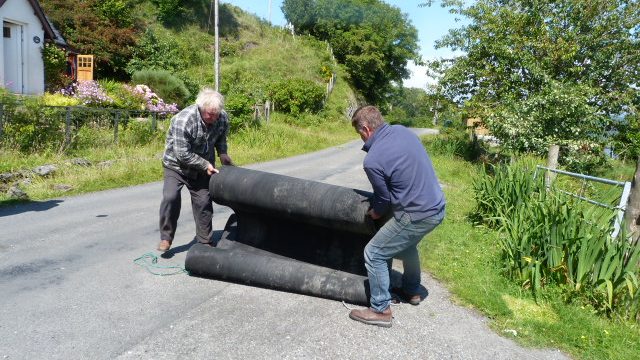 Archie and Jim rolling the road out
