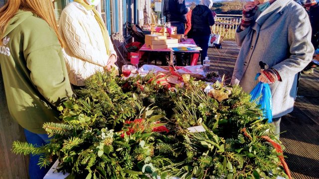 Sadie and Emma selling wreathes and much more